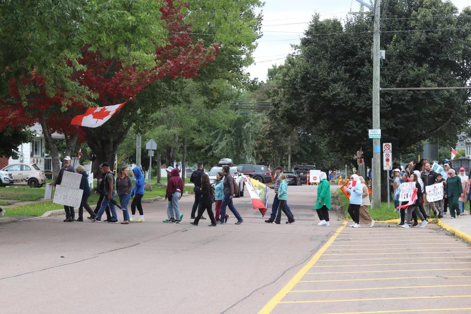 Protesters marched in front of Moncton's Bessborough School.