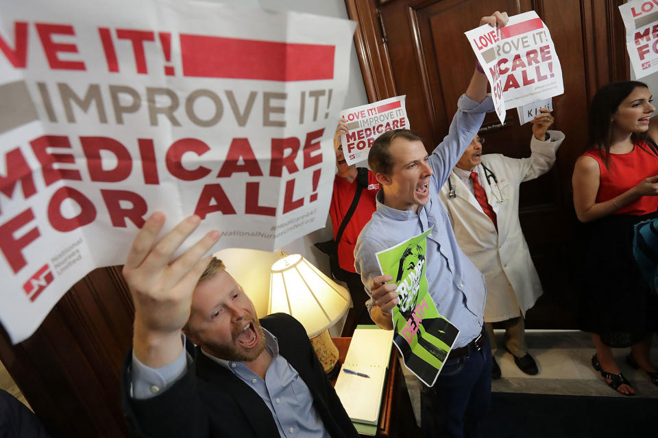 <p>Demonstrators from Texas sit on the ground and chant, “Kill the bill, kill the bill,” inside the offices of Sen. Ted Cruz while protesting against health care reform legislation in the Russell Senate Office Building on Capitol Hill July 10, 2017 in Washington, D.C. More than 100 people from across the country were arrested during the protest that was organized by Housing Works and Center for Popular Democracy. (Photo: Chip Somodevilla/Getty Images) </p>