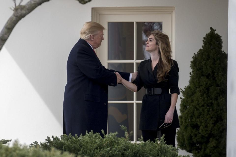 PHOTO: President Donald Trump shakes hands with Hope Hicks, outgoing White House communications director, right, outside the Oval Office, March 29, 2018.  (Andrew Harrer/Bloomberg via Getty Images)