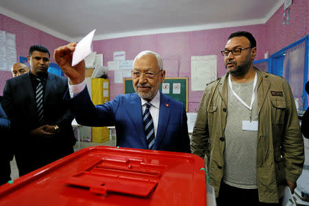 Rached Ghannouchi, head of the Ennahda party, casts his vote at a polling station for the municipal election in Tunis, Tunisia, May 6, 2018. REUTERS/Zoubeir Souissi