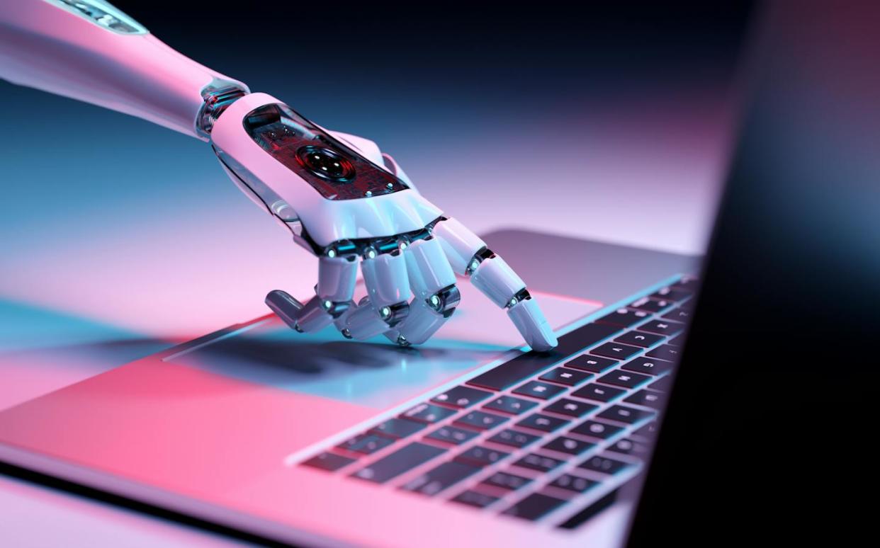 Many educators say they are worried about being unable to keep up with advances in AI. <a href="https://www.gettyimages.com/detail/photo/robotic-hand-pressing-a-keyboard-on-a-laptop-3d-royalty-free-image/1479076594?phrase=AI%2Bwriting" rel="nofollow noopener" target="_blank" data-ylk="slk:Guillaume via Getty Images;elm:context_link;itc:0;sec:content-canvas" class="link ">Guillaume via Getty Images</a>