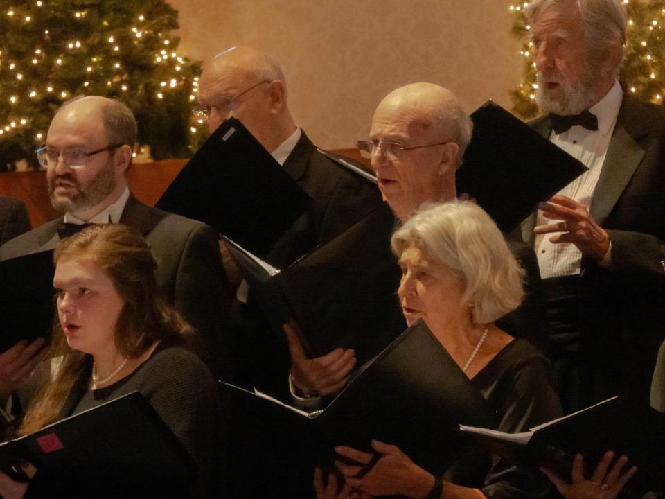 Alto and bass ensemble members of the Lenawee Community Chorus are pictured singing during the community chorus' holiday concert held Dec. 17, 2023, at Adrian College's Herrick Chapel.