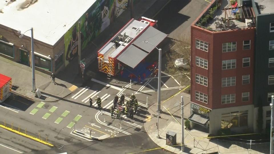 Firefighters, police, a bomb squad and a hazmat team were called to an apartment building in Seattle's Lower Queen Anne neighborhood for reports of an explosion and fire.