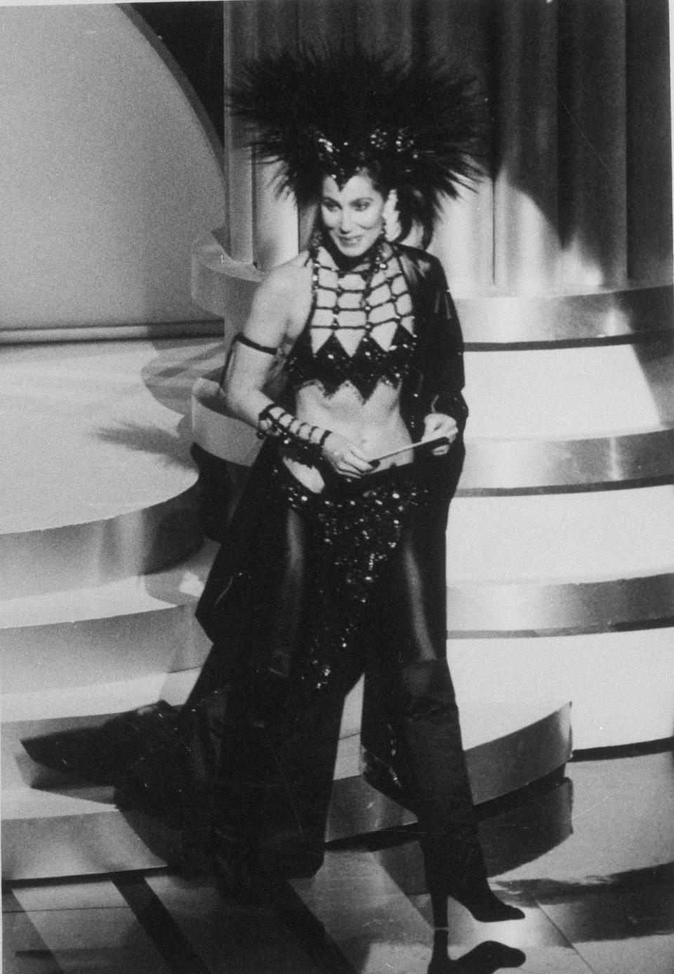 Cher walks on stage at the Dorothy Chandler Pavilion in Los Angeles for the 58th annual Academy Awards ceremony, March 25, 1986. - Credit: AP Photo/Reed Saxon
