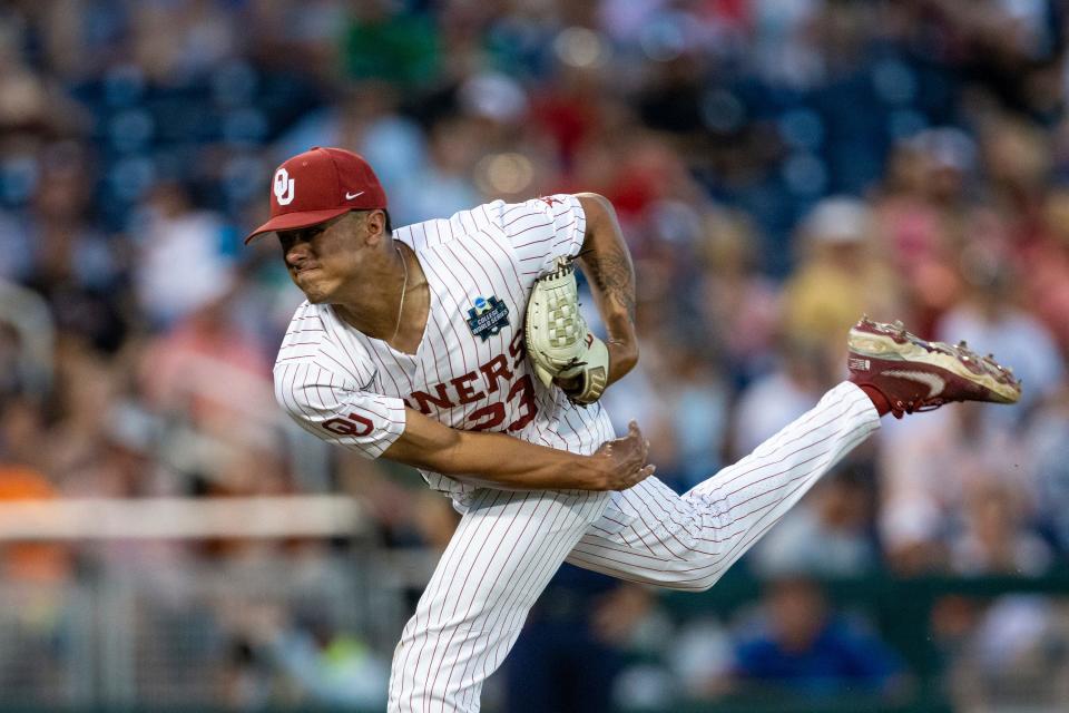 Oklahoma pitcher Jaret Godman (23) throws a pitch against Notre Dame in the sixth inning during an NCAA college World Series baseball game Sunday, June 19, 2022, in Omaha, Neb. (AP Photo/John Peterson)