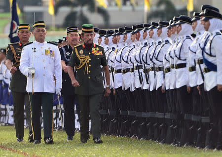 Brunei's Sultan Hassanal Bolkiah inspects an honour guard during the 34th National Day celebrations in Bandar Seri Begawan, Brunei February 24, 2018. Picture taken February 24, 2018. REUTERS/Ahim Rani
