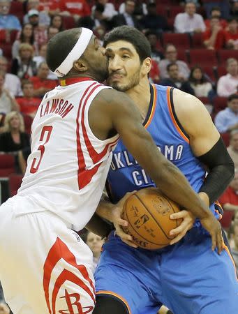 Nov 2, 2015; Houston, TX, USA; Houston Rockets guard Ty Lawson (3) fouls Oklahoma City Thunder center Enes Kanter (11) in the third quarter at Toyota Center. Rocket won 110 to 105. Mandatory Credit: Thomas B. Shea-USA TODAY Sports