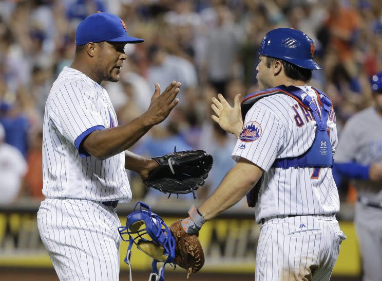 Jeurys Familia, left, celebrates with Travis d'Arnaud. (AP Photo/Julie Jacobson)