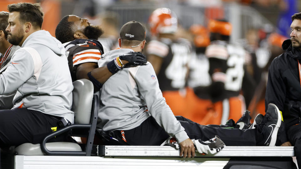 FILE - Cleveland Browns linebacker Anthony Walker Jr. (5) is taken off the field after being injured during the second half of an NFL football game against the Pittsburgh Steelers in Cleveland, Thursday, Sept. 22, 2022. No injuries cause more lost time in the NFL than those painful pulls and pesky strains of the leg muscles that give players the burst they need to keep up in this speed-based game. The league has committed millions of dollars to studying, treating and preventing these lower extremity injuries, seeing progress in minimizing the problems with the hamstring, quad, calf and the like. (AP Photo/Ron Schwane, File)