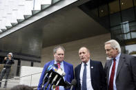British cave explorer Vernon Unsworth, center, with his attorneys, Mark Stephens, left, and Lin Wood, right, walk out of Los Angeles U.S. District Court Friday, Dec. 6, 2019. Elon Musk did not defame Unsworth when he called him “pedo guy” in an angry tweet, a Los Angeles jury found Friday. Unsworth, who participated in the rescue of 12 boys and their soccer coach trapped for weeks in a Thailand cave last year, had angered the Tesla CEO by belittling his effort to help with the rescue as a “PR stunt.” (AP Photo/Damian Dovarganes)