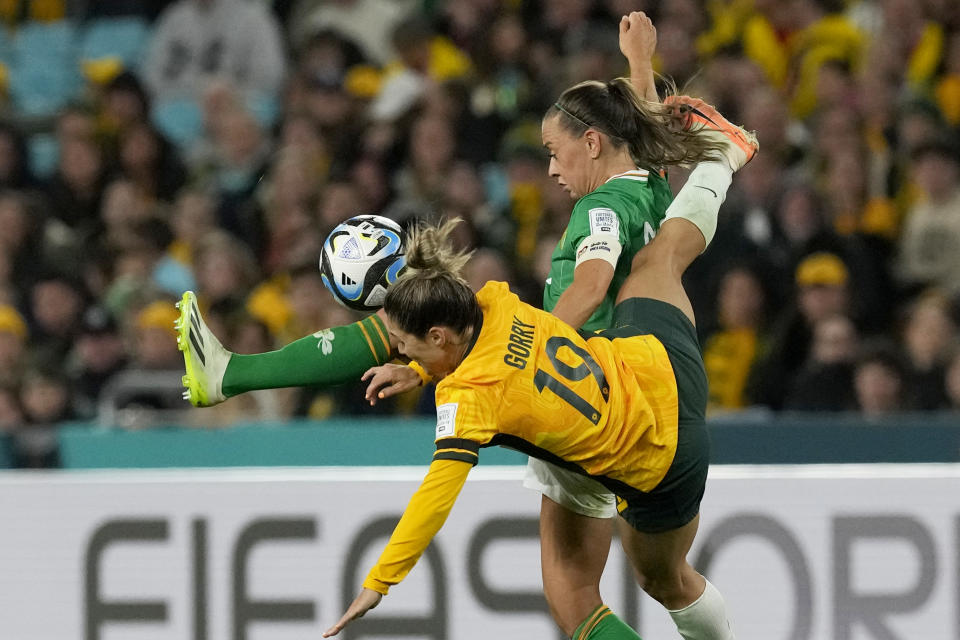 Australia's Katrina Gorry, left, fights for the ball with Ireland's Katie McCabe during the Women's World Cup soccer match between Australia and Ireland at Stadium Australia in Sydney, Australia, Thursday, July 20, 2023. (AP Photo/Mark Baker)