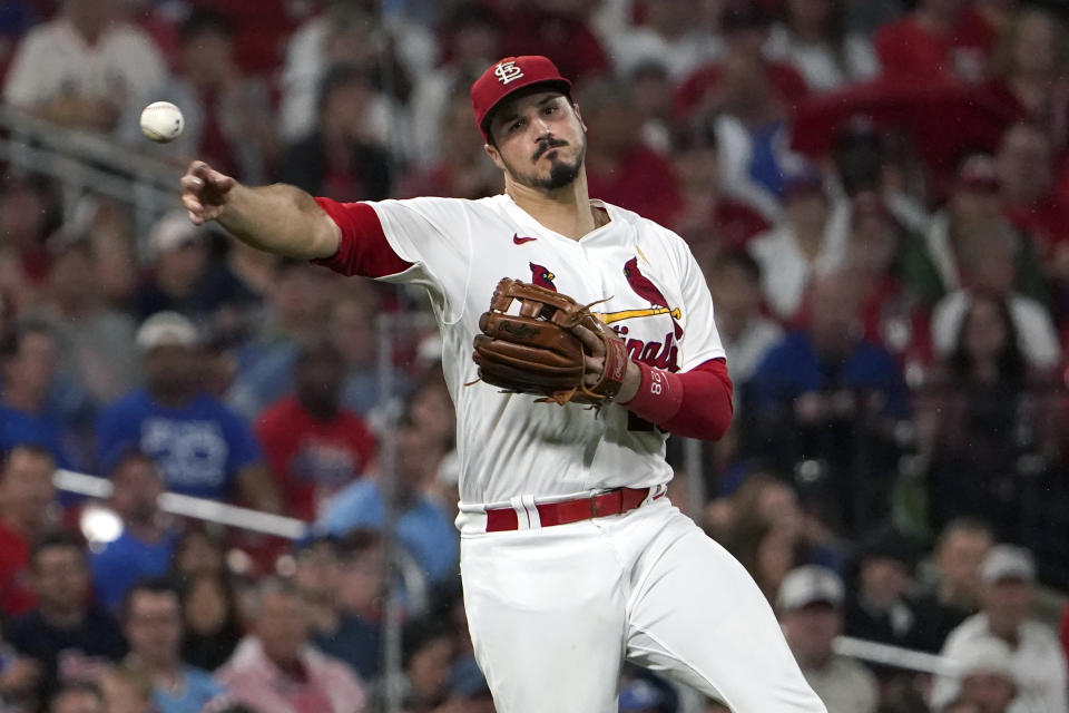 St. Louis Cardinals third baseman Nolan Arenado throws out Chicago Cubs' Nick Madrigal at first during the fifth inning of a baseball game Friday, Sept. 2, 2022, in St. Louis. (AP Photo/Jeff Roberson)
