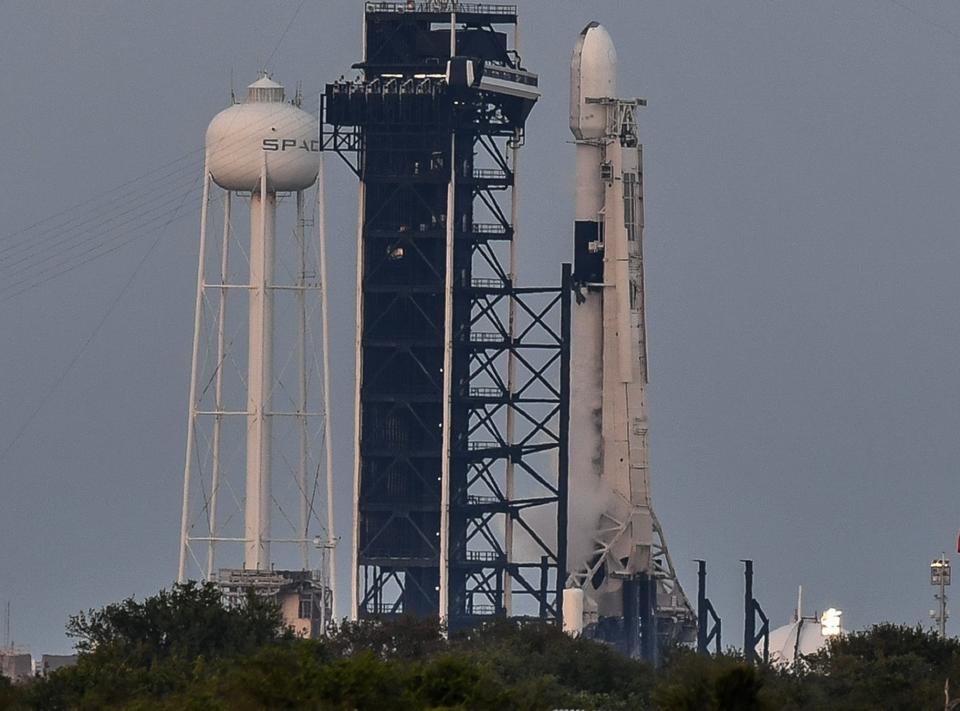 A SpaceX Falcon 9 rocket remained on the launch pad Thursday at NASA's Kennedy Space Center.