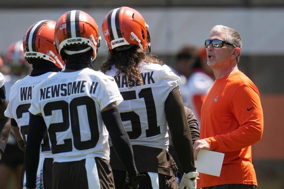 Browns defensive coordinator Jim Schwartz talks with players during practice May 31, 2023, in Berea.