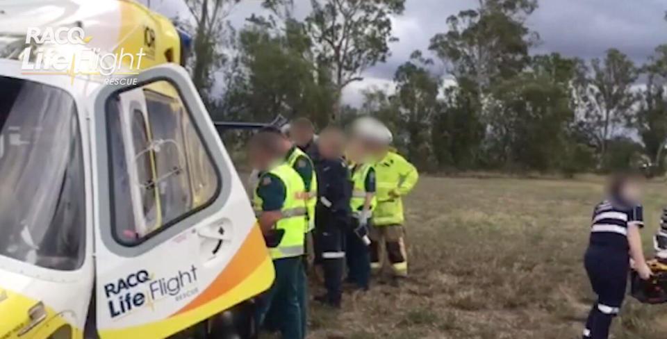 A woman has been airlifted to hospital after she stopped to help victims of a car crash near Toowoomba. She was hit by a car.