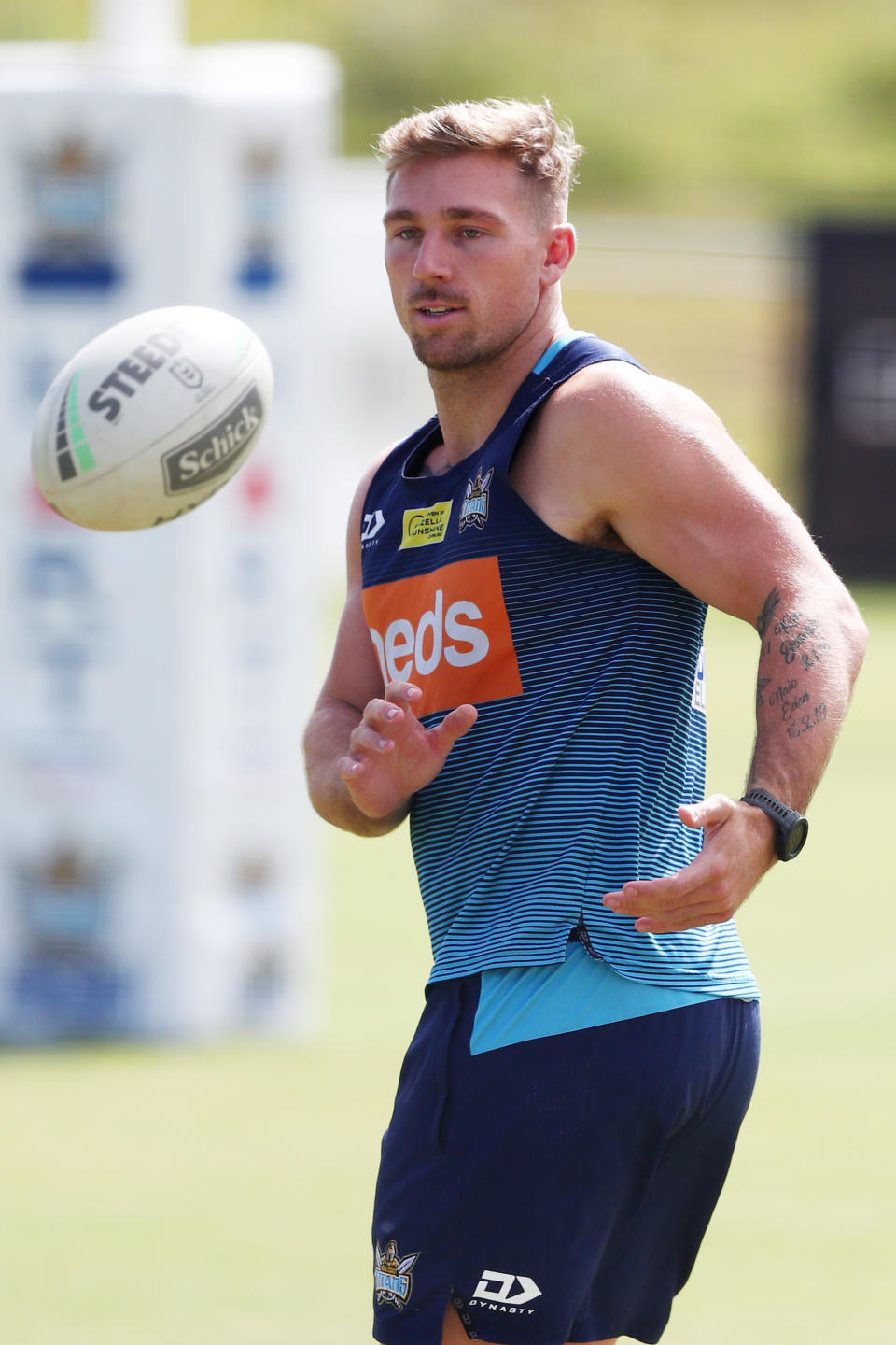 Bryce Cartwright passes during at Gold Coast NRL training session at Gold Coast Titans HQ.