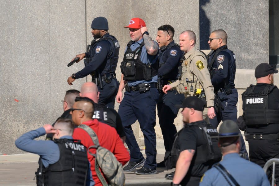 Law enforcement personnel arrive at Union Station following a shooting at the Kansas City Chiefs NFL football Super Bowl celebration in Kansas City, Mo., Wednesday, Feb. 14, 2024. Multiple people were injured, a fire official said. (AP Photo/Reed Hoffmann)