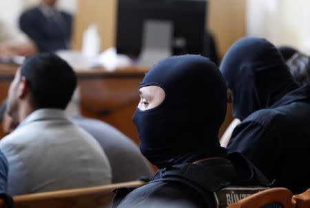 An special policeman is seen during the trial in which four men are charged with causing the death of 71 migrants who suffocated in a lorry found beside an Austrian motorway in 2015, in Kecskemet, Hungary June 21, 2017. REUTERS/Bernadett Szabo