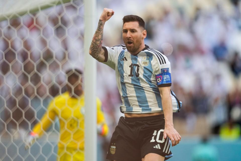 Argentina's Lionel Messi celebrates after scoring from the penalty spot his side's opening goal during the World Cup group C football match between Argentina and Saudi Arabia at the Lusail Stadium in Lusail, Qatar, Tuesday, Nov. 22, 2022. (AP Photo/Jorge Saenz)