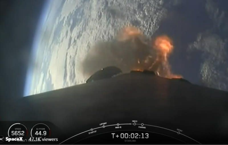 A reusable booster rocket returns to a drone in the Atlantic Ocean after a SpaceX rocket carried 23 Starlink satellites into low-Earth orbit. (Courtesy of SpaceX)