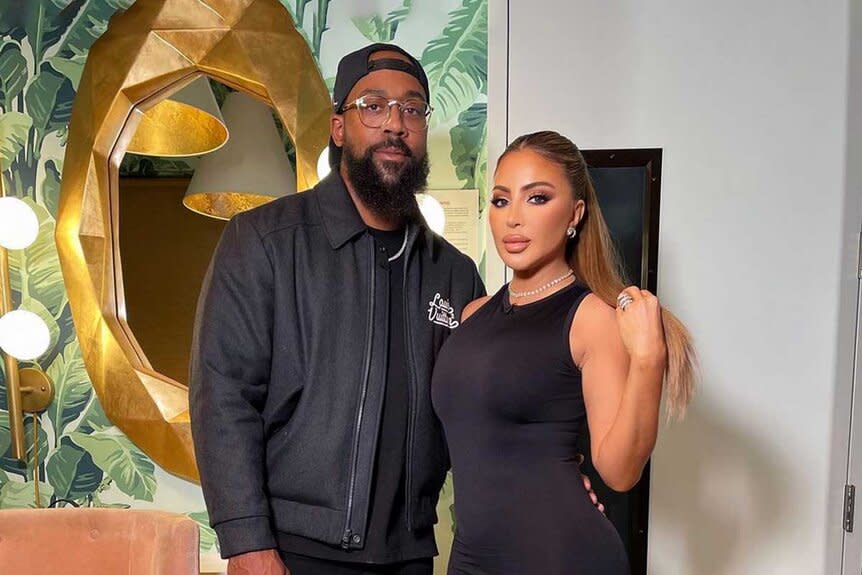 Larsa Pippen and Marcus Jordan pose together