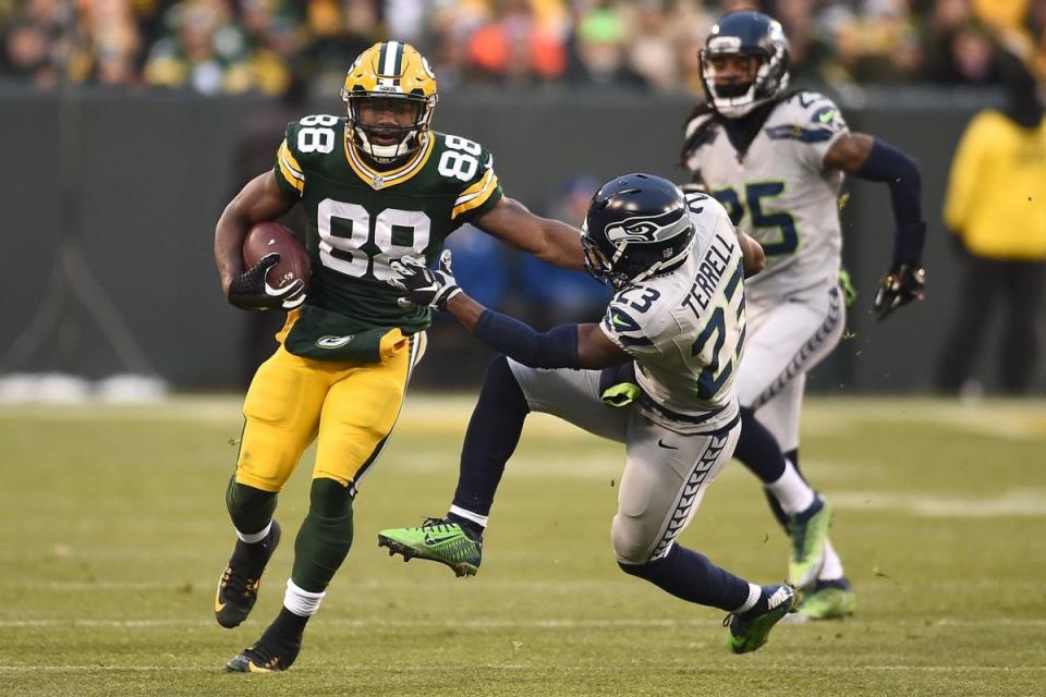 Ty Montgomery of the Green Bay Packers is pursued by Steven Terrell of the Seattle Seahawks during a game at Lambeau Field . (Photo by Stacy Revere/Getty Images)