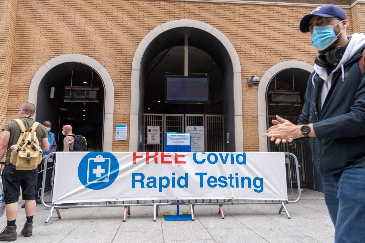 People walk past a rapid COVID-19 testing center in London, Britain, Aug. 30, 2021. Another 26,476 people in Britain have tested positive for COVID-19, bringing the total number of coronavirus cases in the country to 6,757,650, according to official figures released Monday. (Photo by Ray Tang/Xinhua via Getty Images)