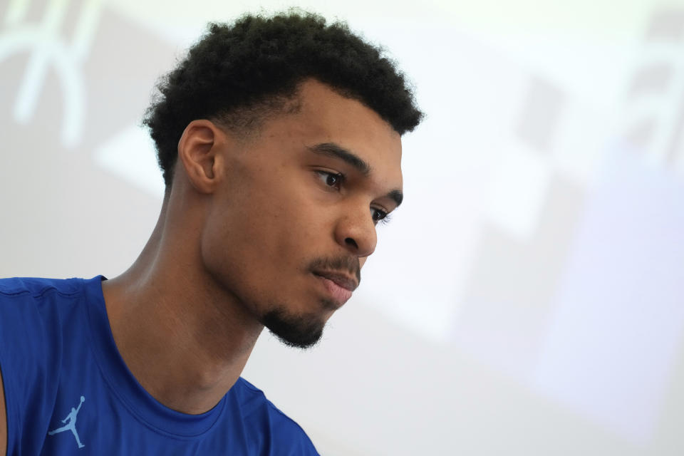 France's basketball player Victor Wembanyama, who plays for the NBA San Antonio Spurs, speaks during media day at the French National Institute of Sport and Physical Education, in Vincennes, outside Paris, Thursday, June 27, 2024. (AP Photo/Thibault Camus)