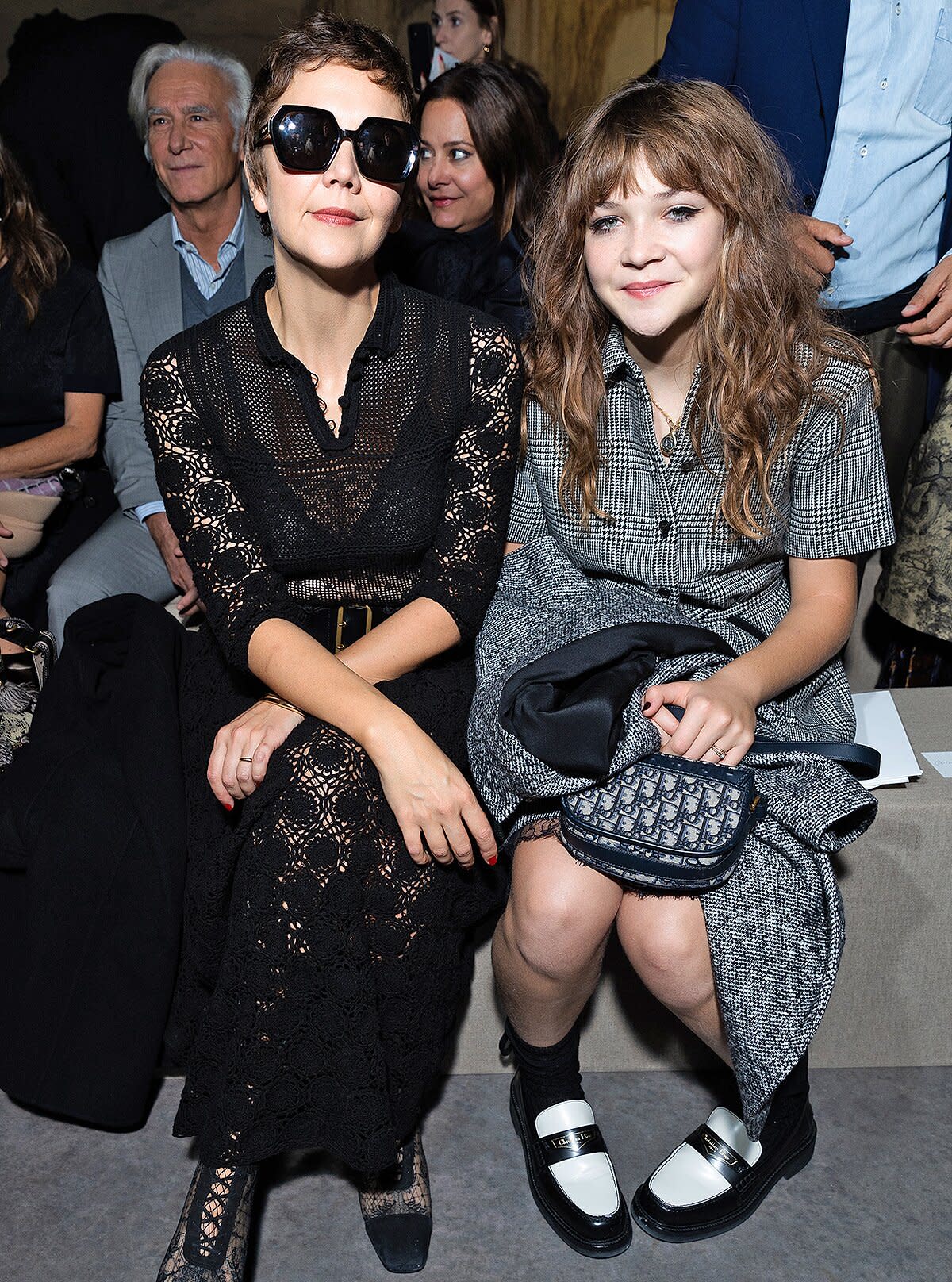 Maggie Gyllenhaal and Ramona Sarsgaard attend the Christian Dior Womenswear Spring/Summer 2023 show as part of Paris Fashion Week on September 27, 2022 in Paris, France.