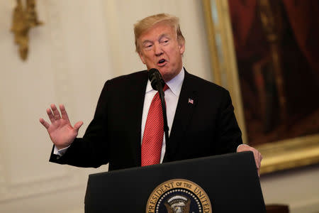 U.S. President Donald Trump speaks prior to awarding the Medal of Honor to Vietnam War veteran retired Marine Corps Sergeant Major John Canley in the East Room of the White House in Washington, U.S., October 17, 2018. REUTERS/Yuri Gripas