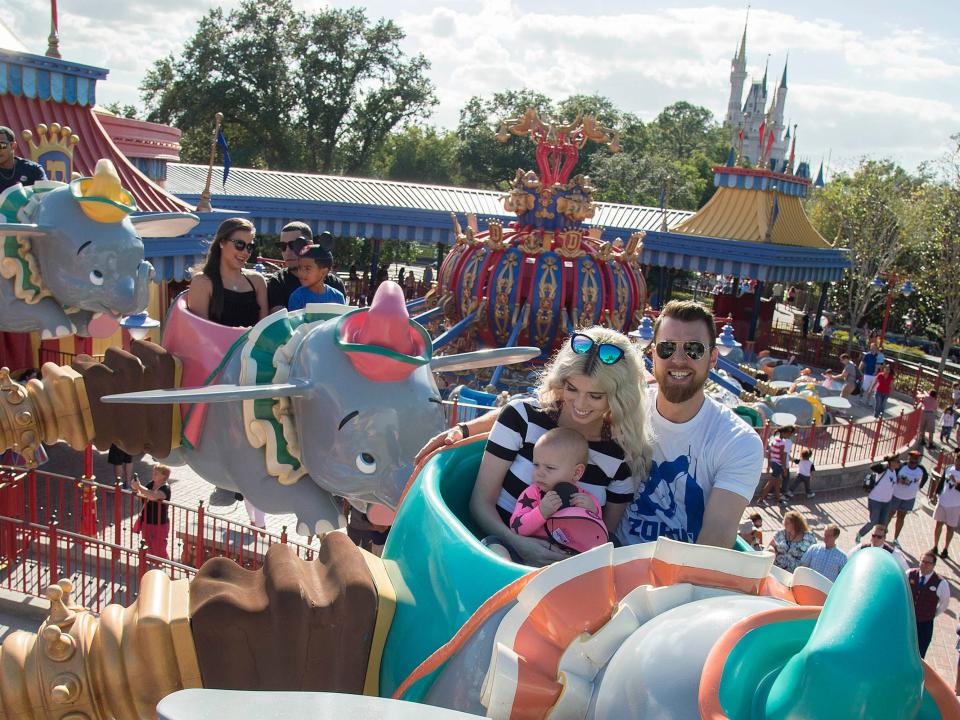 View from on the ride looking back at other patrons riding in the elephant compartments in the air.