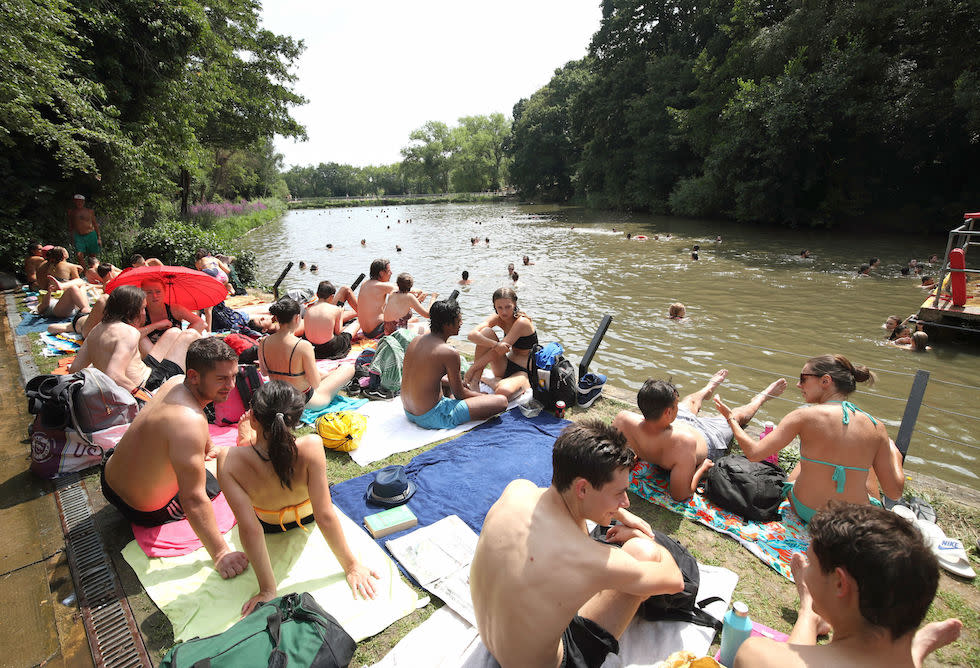 People sunbathing at the mixed bathing pond on Hampstead Heath, London, last week (Picture: PA)