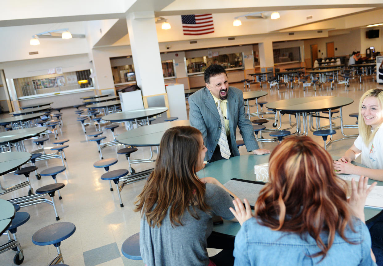 Former Columbine principal DeAngelis chats with students at the school in April 2014. (Photo: RJ Sangosti/The Denver Post via Getty Images)