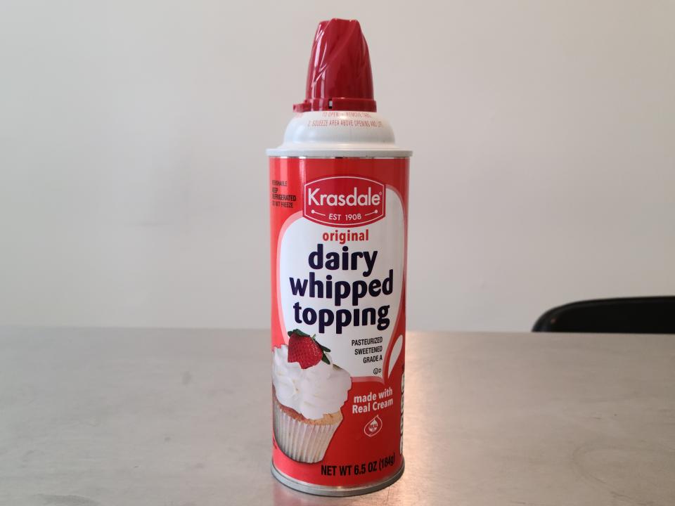can of krasdale whipped cream on a table