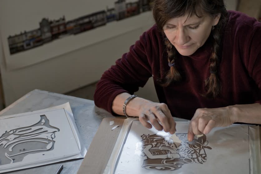 Kim Abeles, an artist whose work often centers around the environment, works on her Smog Collectors project.