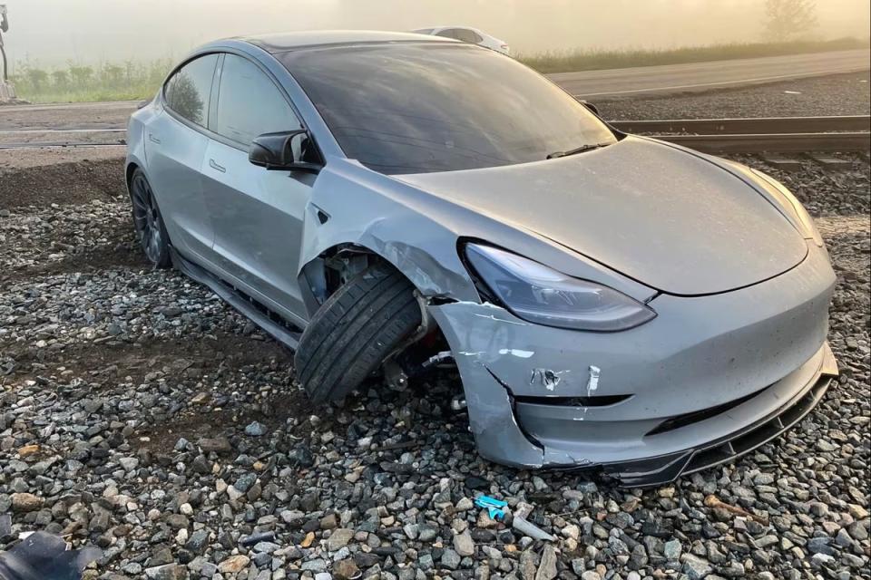 A self-driving Tesla in Camden, Ohio, narrowly avoided colliding with a train, after the vehicle did not register it (Craig Doty/ NBC News)