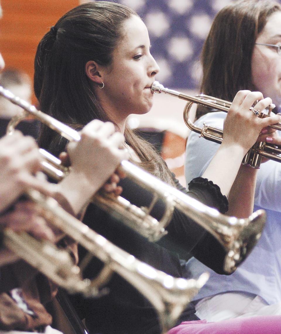 Thomas Ewing eighth grader, Sara Anne Folk plays her trumpet at the All-City Band Concert. The concert with special guest conductor and composer James Swearingen and bands from Thomas Ewing, General Sherman, Stanberry Freshman and Lancaster High Schools performed at the high school gymnasium to a large crowd on Sunday.