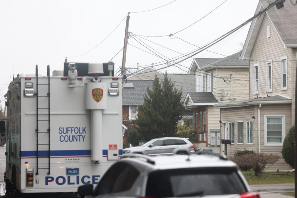 Suffolk County Police Crime Scene investigators outside of a home on Railroad Avenue in Amityville, New York on March 5, 2024, in connection to body parts that had been discovered at Southards Pond Park in Babylon, Bethpage State Park, and West Babylon. Prosecutors said Monday that police recovered two meat cleavers and other large knives and found blood in multiple rooms inside the house.