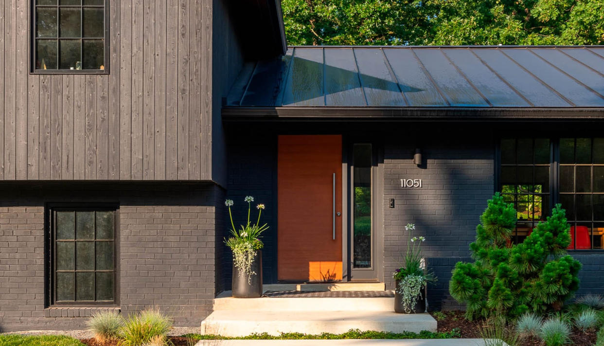  Modern home with simple modern planting in the front yard 