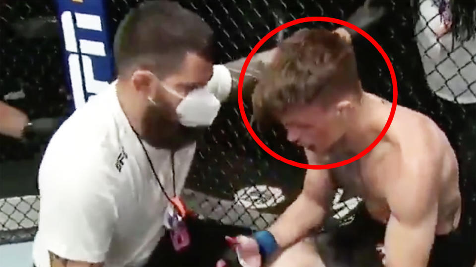 UFC fighter Max Rohskopf is pictured asking his trainer to end his bout.