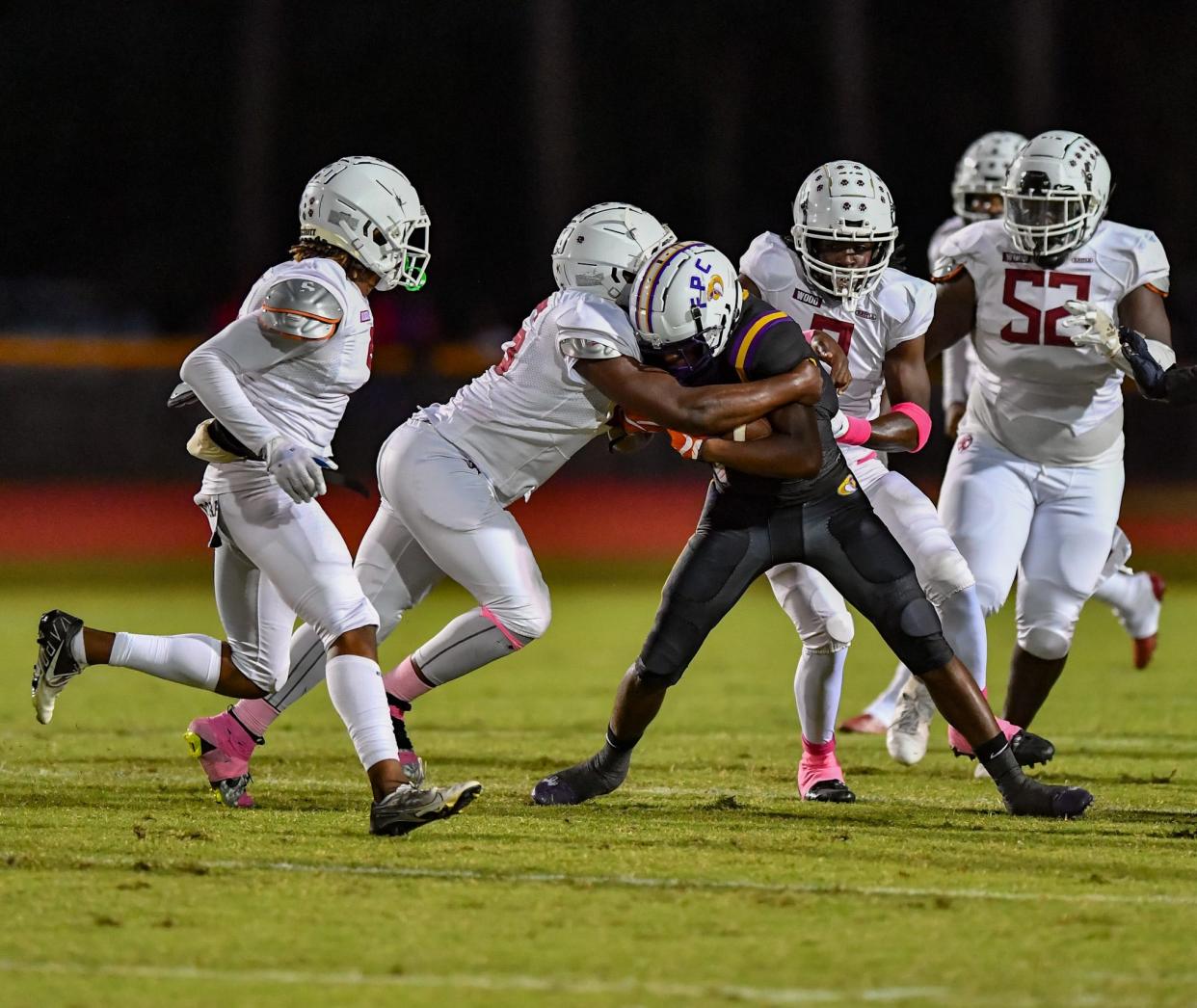 Westwood's Chris Pierre (right) pursues a Fort Pierce Central runner in a high school football game, Friday, Oct. 20, 2023, at Lawnwood Stadium.