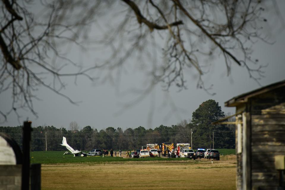 Emergency personnel at the site of a small plane that crashed at Gray's Creek Airport on Butler Nursery Road on Monday, Feb. 17, 2020. [Andrew Craft/The Fayetteville Observer]