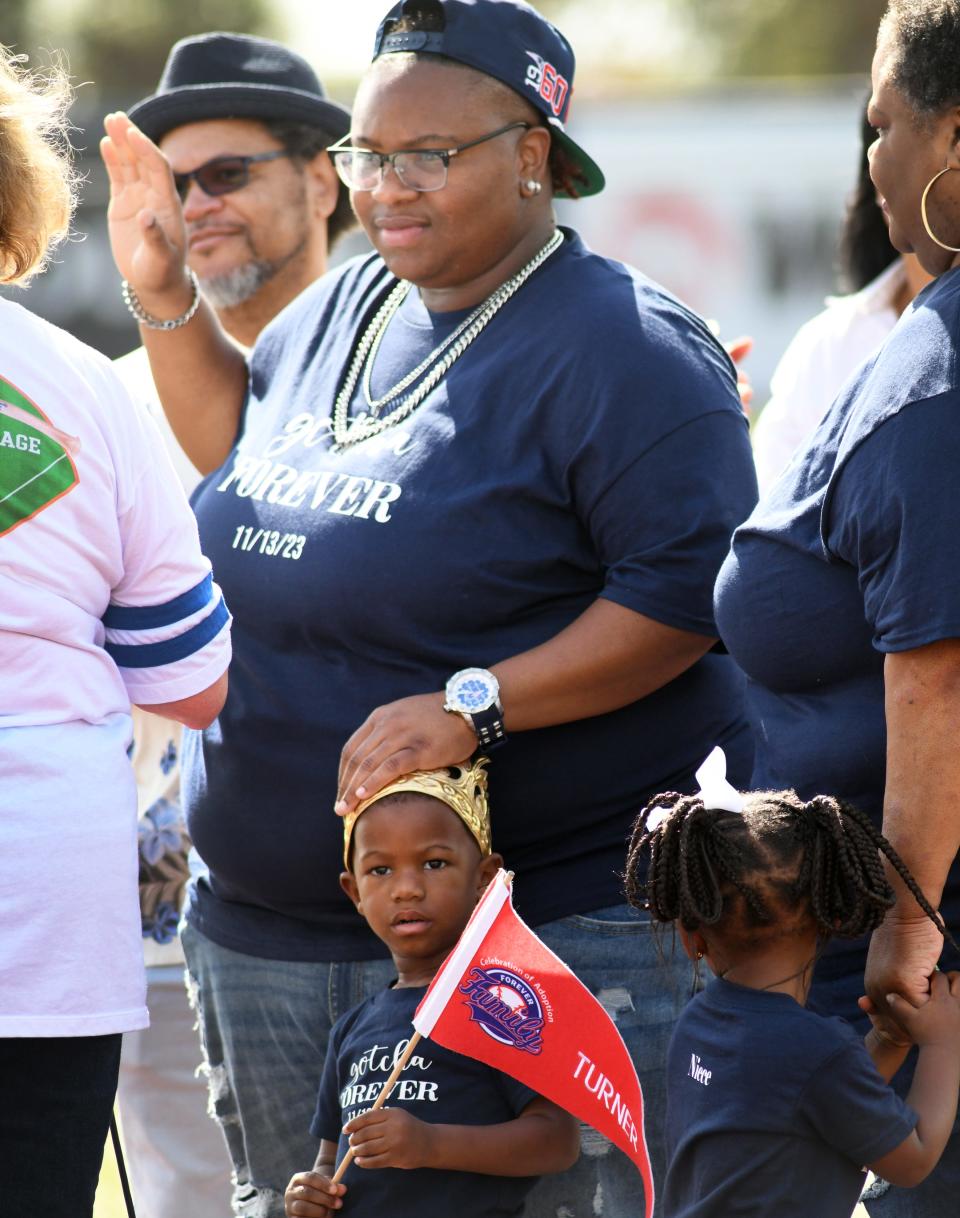 Chekinaa Turner adopted 2-year-old Josiah Charles during a "Celebration of Adoption" at the USSSA Space Coast Complex stadium Monday. Brevard Family Partnership, DCF, Camelot Community Care and other agencies took part in the special day for 10 families adopting 12 children.
(Credit: TIM SHORTT / FLORIDA TODAY)..