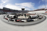 In this picture made with a fisheye lens, cars are readied for a NASCAR Xfinity Series auto race at Bristol Motor Speedway Monday, June 1, 2020, in Bristol, Tenn. (AP Photo/Mark Humphrey)