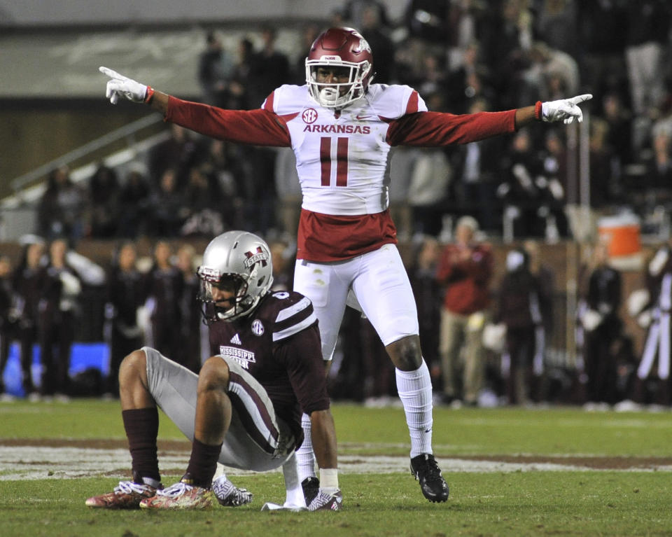 Nov 19, 2016; Starkville, MS, USA; Arkansas Razorbacks defensive back Ryan Pulley (11) reacts after the play against Mississippi State Bulldogs wide receiver Fred Ross (8) during the first half at Davis Wade Stadium. Mandatory Credit: Justin Ford-USA TODAY Sports