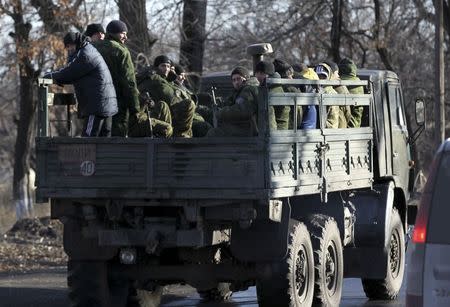 Pro-Russian separatists ride on a truck near the village of Hrabove (Grabovo) in Donetsk region, eastern Ukraine November 20, 2014. REUTERS/Antonio Bronic