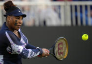 Serena Williams of the United States returns the ball during their doubles tennis match with Ons Jabeur of Tunisia against Marie Bouzkova of Czech Republic and Sara Sorribes Tormo of Spain at the Eastbourne International tennis tournament in Eastbourne, England, Tuesday, June 21, 2022. (AP Photo/Kirsty Wigglesworth)