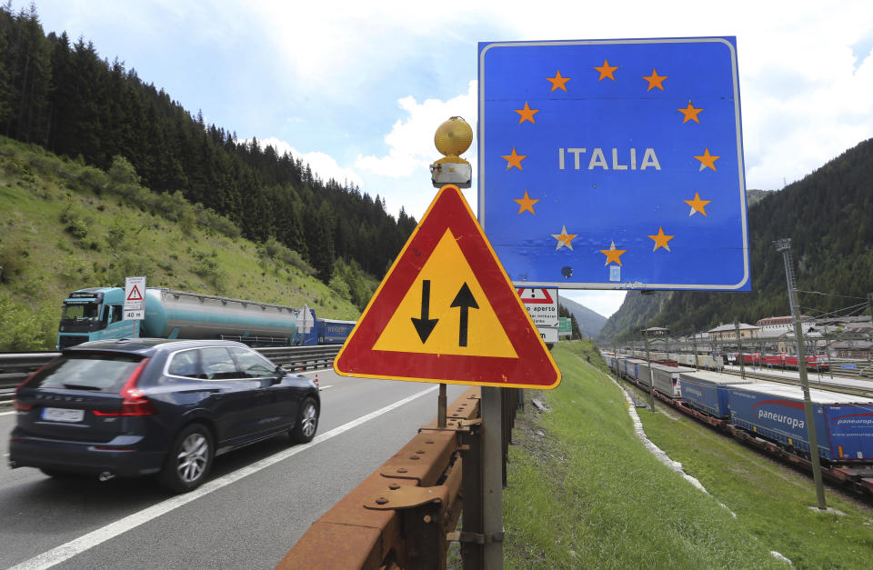 A car from Germany drives from Austrian to Italy at the Brenner Pass boarder crossing, Italy, Wednesday, June 3, 2020. Italy opened its borders to the citizens of the EU and Switzerland this June 3, following a Coronavirus lockdown with closed boarders and traveling restrictions. (Karl-Josef Hildenbrand/dpa via AP)