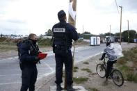 French police post the official document that announces the dismantling of the makeshift camp called the "Jungle", in Calais, France, October 21, 2016. REUTERS/Pascal Rossignol