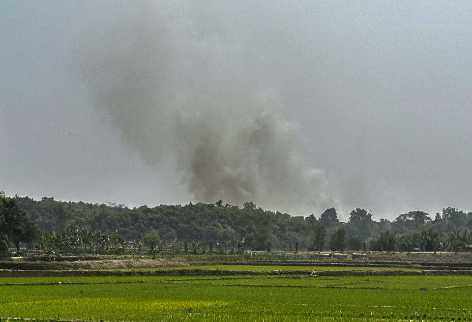 Smoke is seen bellowing from a Myanmar Border Police post following fighting between Myanmar security forces and Arakan Army, an ethnic minority army, in Ghumdhum, Bandarban, Bangladesh, on Monday, Feb. 5, 2024. Nearly a hundred members of Myanmar's Border Guard Police have fled their posts and taken shelter in Bangladesh during fighting between Myanmar security forces and an ethnic minority army, an official of Bangladesh's border agency said Monday. (AP Photo/Shafiqur Rahman)